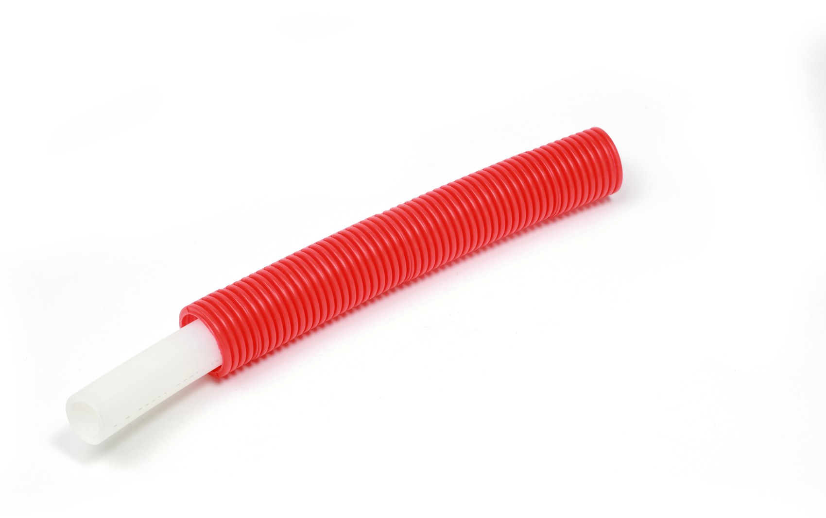 A red Livoplast sleeve with the white PE-RT inner pipe sliding out of it.